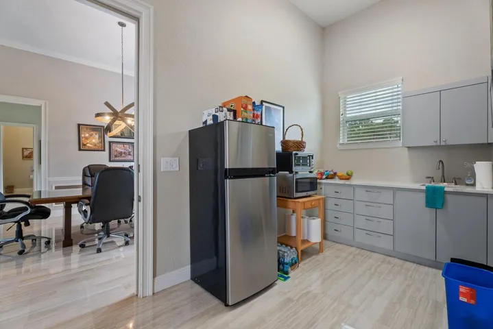 Kitchenette in the inlaw suite, showing the access door to the flex space conference room and door into the media room. Either door can be locked off to make the inlaw suite either a studio or a one bedroom apt.