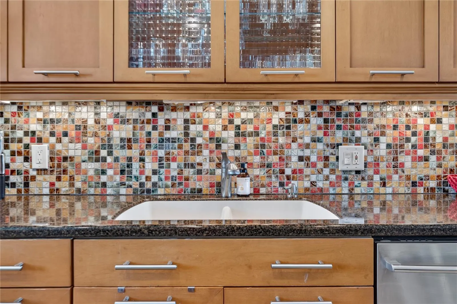 Kitchen with Granite Counter tops, Stainless steel appliances and wood cabinets