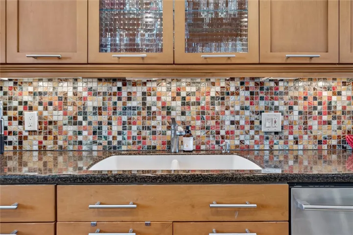 Kitchen with Granite Counter tops, Stainless steel appliances and wood cabinets