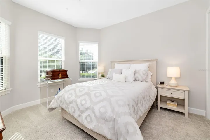 The second ensuite bedroom, in the front of the home, offers ta offers a three window bay and a full bath with a tub/shower combination.