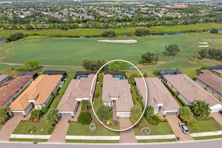 Aerial view of the home and golf fairway