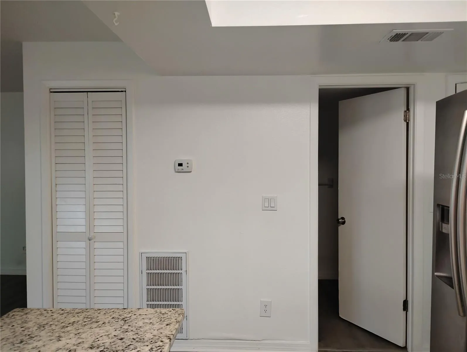 Living Room/Hallway Closet &amp; Bathroom entrance from Kitchen view.