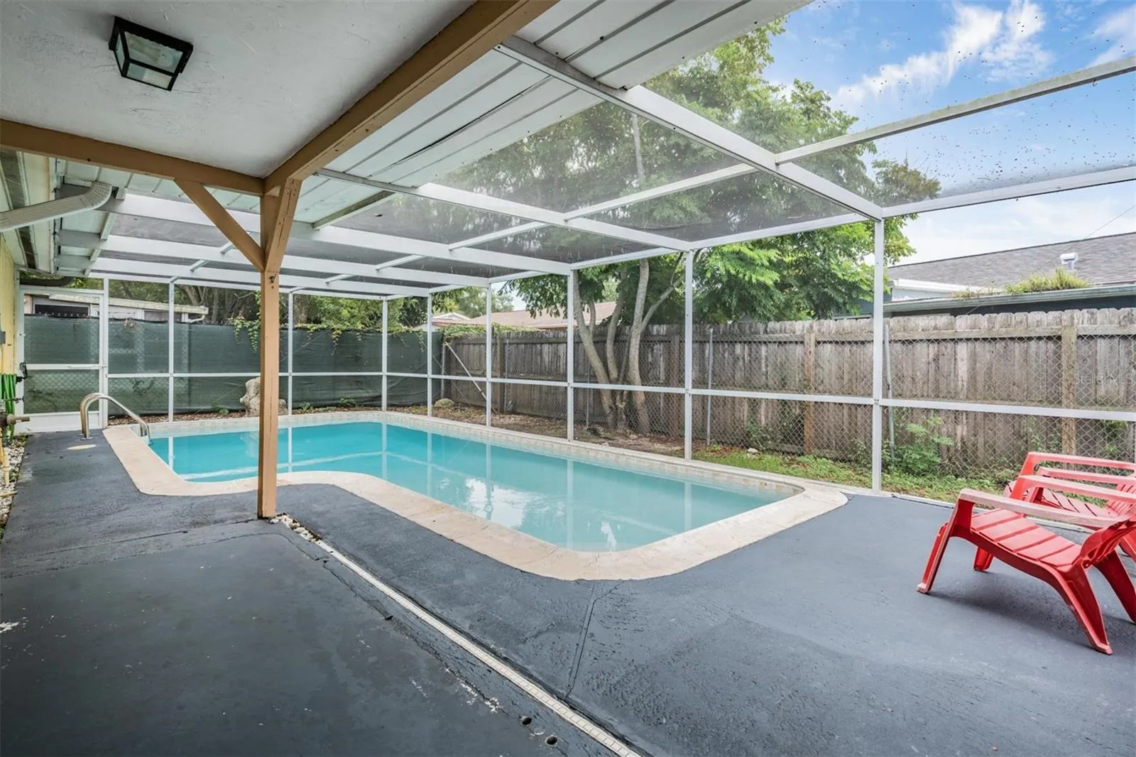 screened in pool and patio perfect for enjoying sunshine year-round