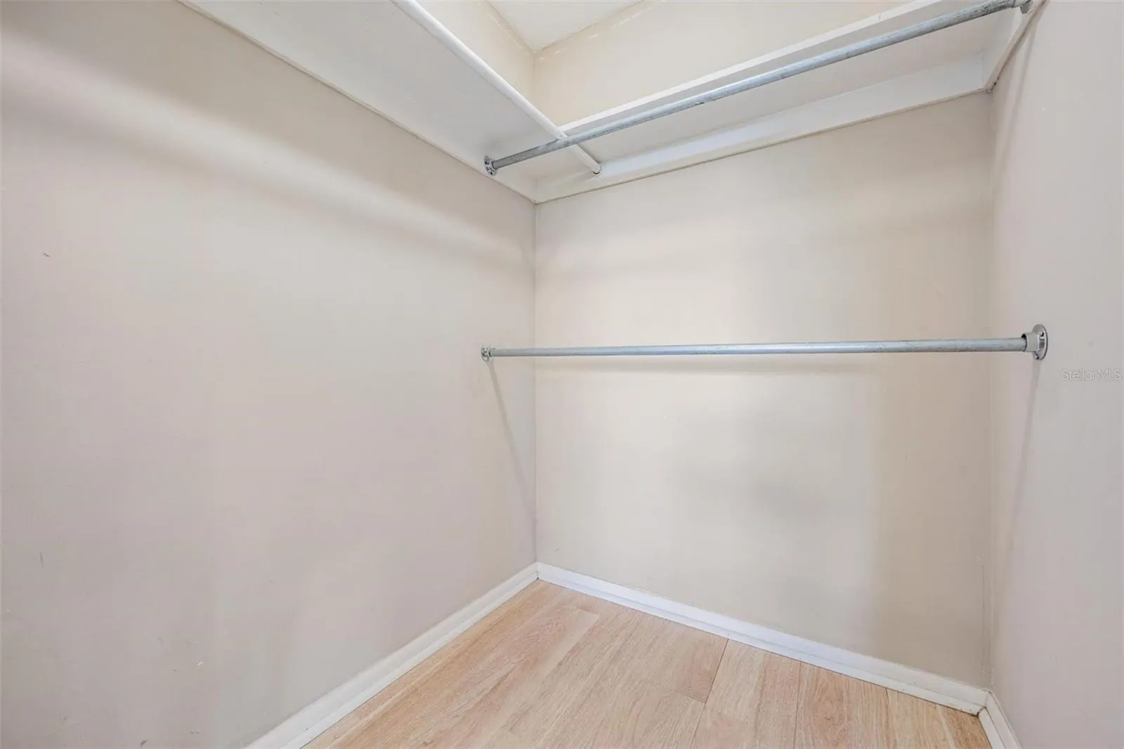 Primary bedroom walk-in closet