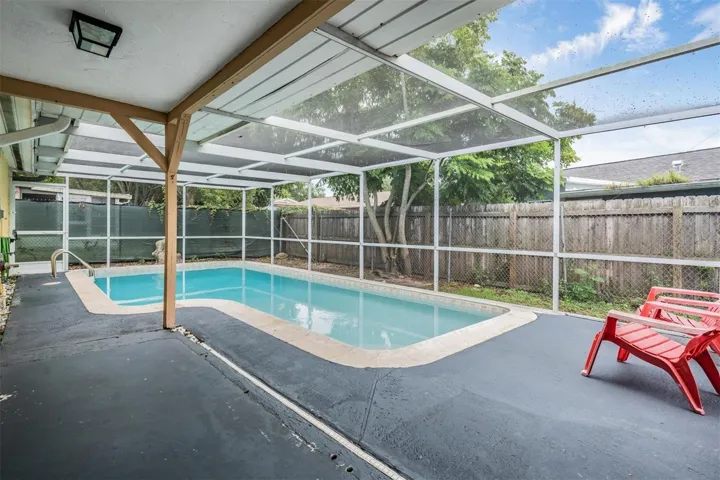 screened in pool and patio perfect for enjoying sunshine year-round
