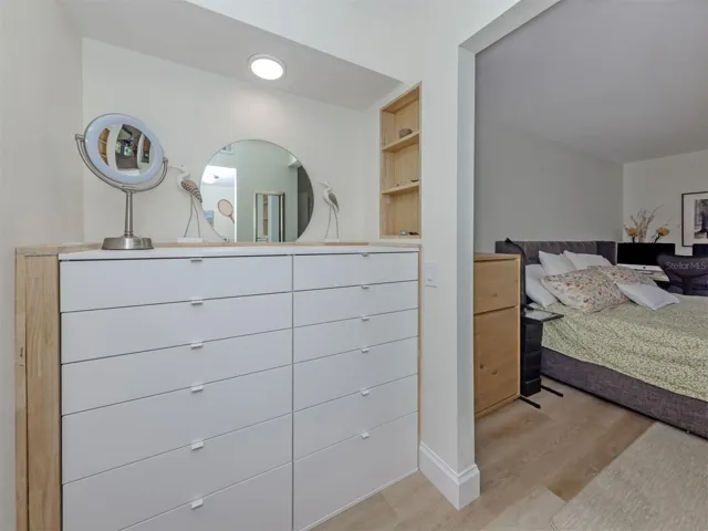 Primary Bedroom built-in, walk-in closet across