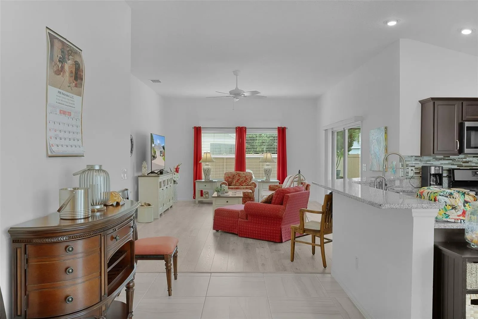 There's a breakfast bar with granite countertops