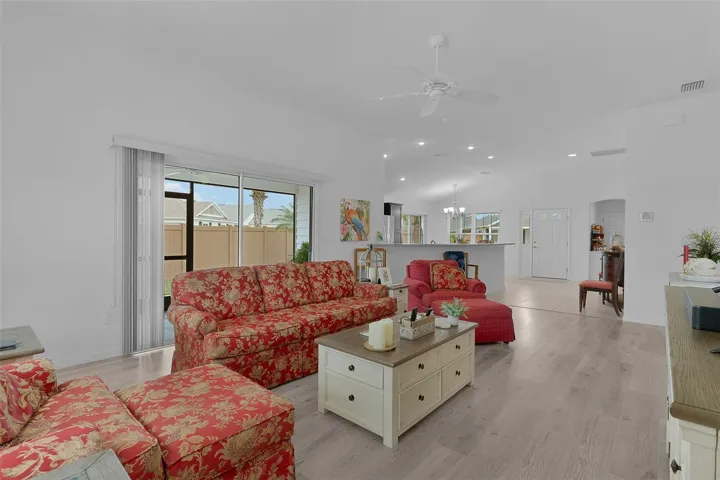 Large living room with the side screen lanai to extend living space outdoors