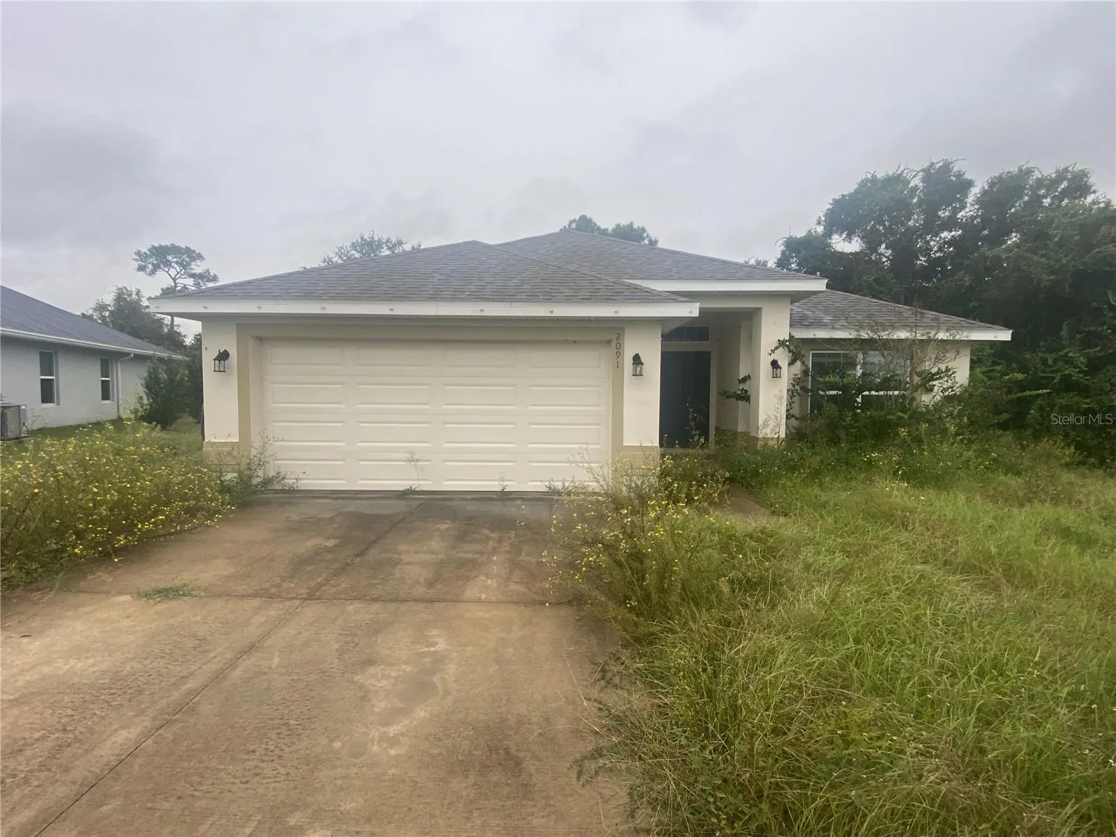 Front View of Home Prior to Grass Cutting.