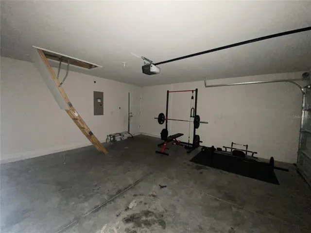 Garage Showing Access Ladder to Attic.
