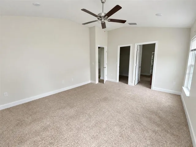 Primary Bed Room. View towards En-suite and Walk-In Closet