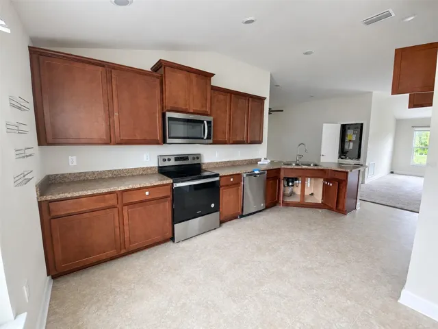 View of Kitchen Cabinets and Peninsula.