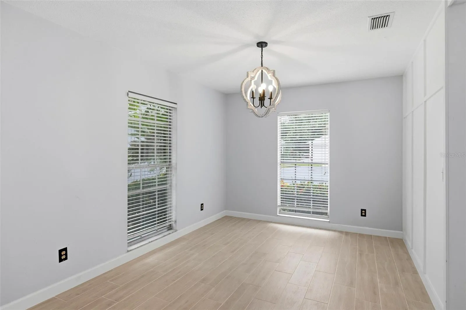 Another view of the dining room.  Large, long windows lend lots of light to this bright and airy home!