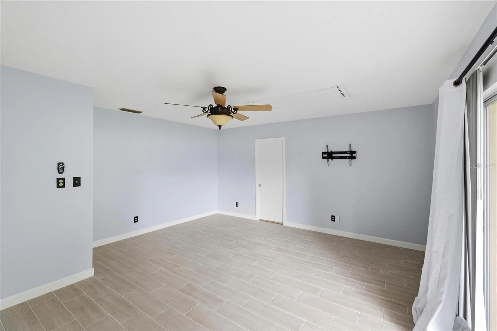 Lots of floorspace in this primary bedroom with ensuite bathroom and closet