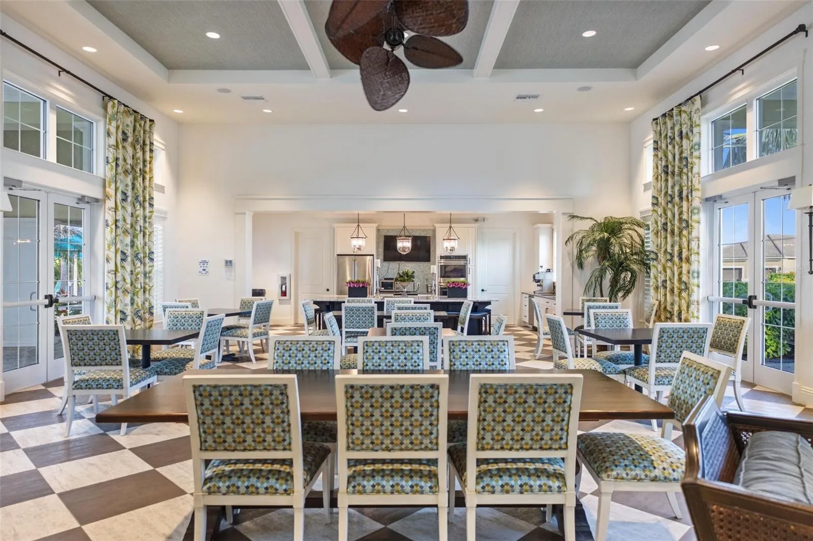 Dining area overlooking the natural surroundings outside including the golf course.