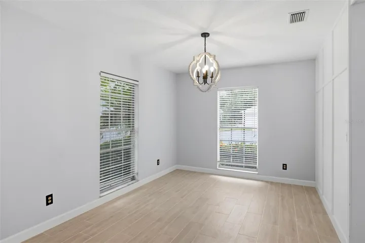 Another view of the dining room.  Large, long windows lend lots of light to this bright and airy home!