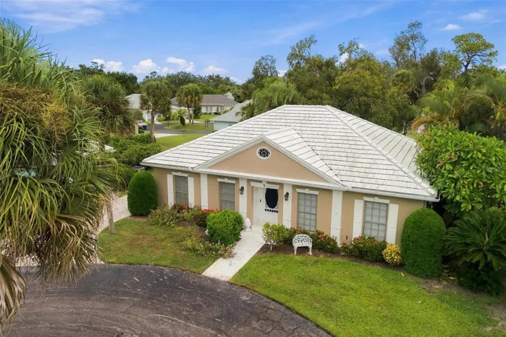 The tile roof completes the exterior charm of this home.