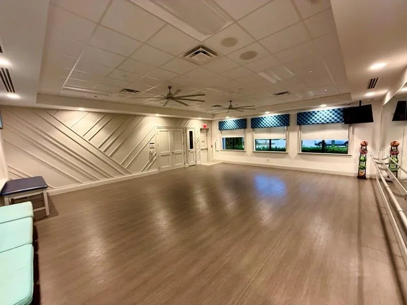 Studio with large storage that contains Pilates/gym weights and ping pong tables