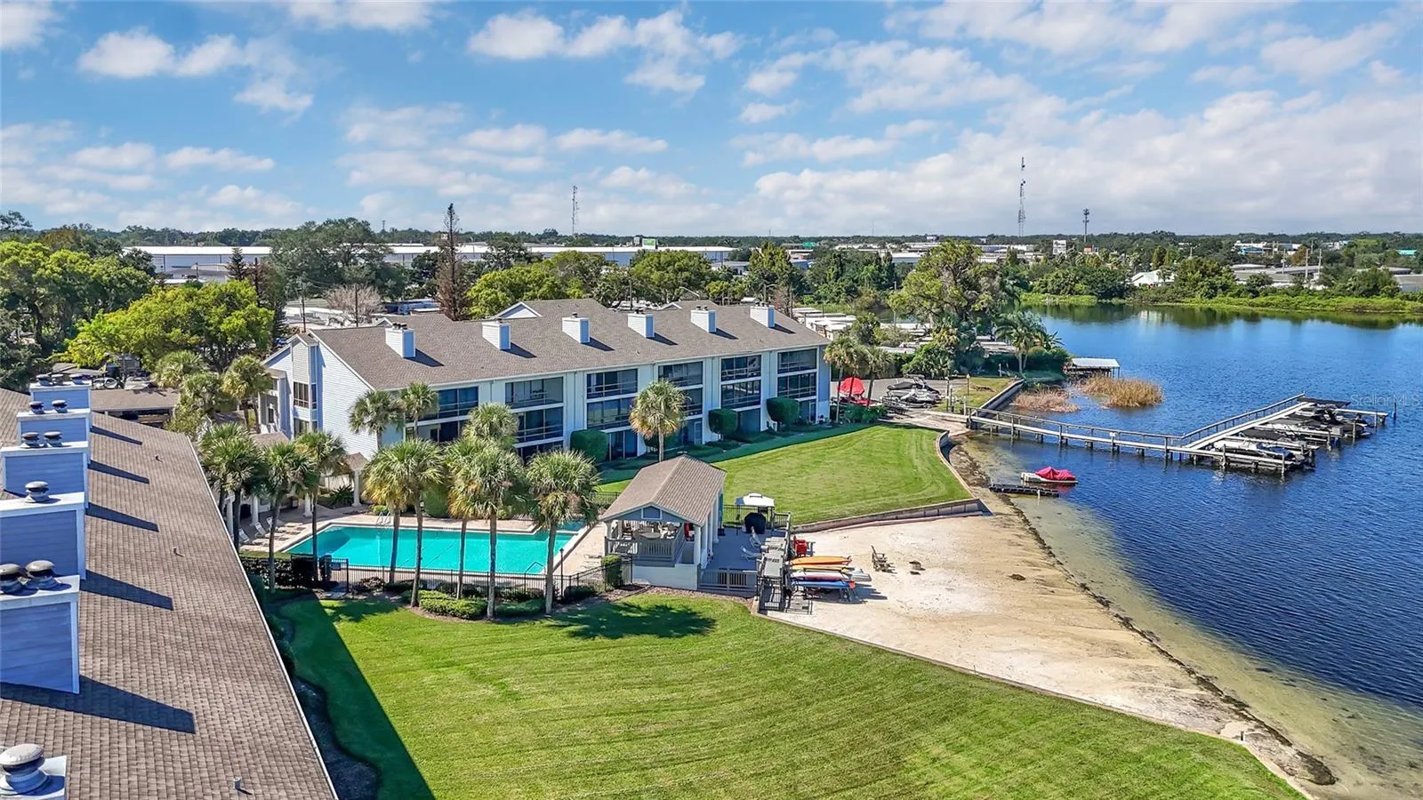 Aerial View of Community Pool, Boat Slip, and Sandy Shoreline of Lake Fairview