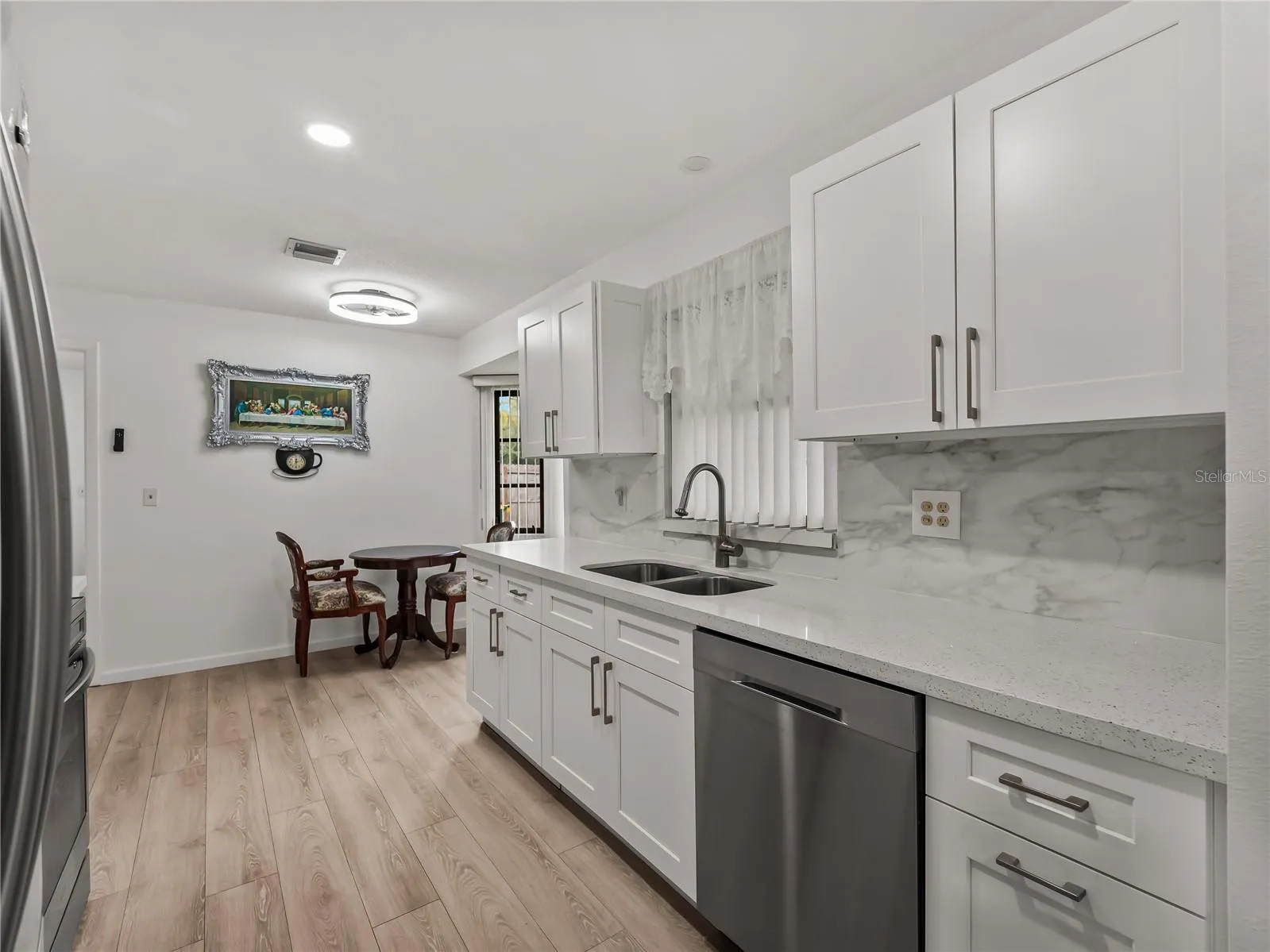 Kitchen_20307SilentAve_PortCharlotte_WhiteCabinetry_Wide.jpg