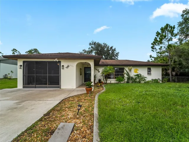 FrontExterior_20307SilentAve_PortCharlotte_Driveway_Corner.jpg