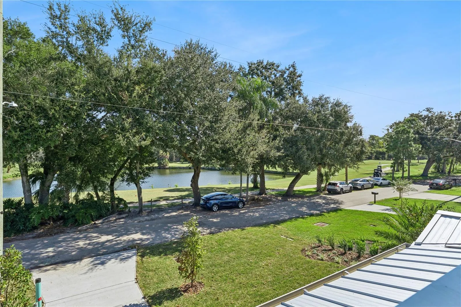 An upper-level outlook takes in the pond and trees across the street.