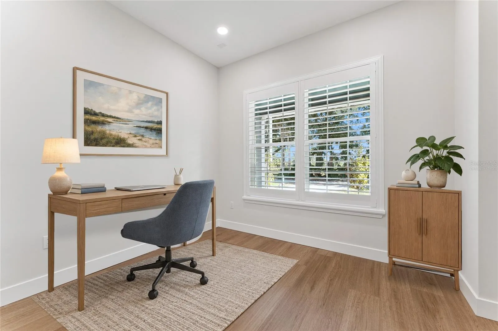 Virtually Staged - Paired shuttered windows bring natural light into this first floor office.