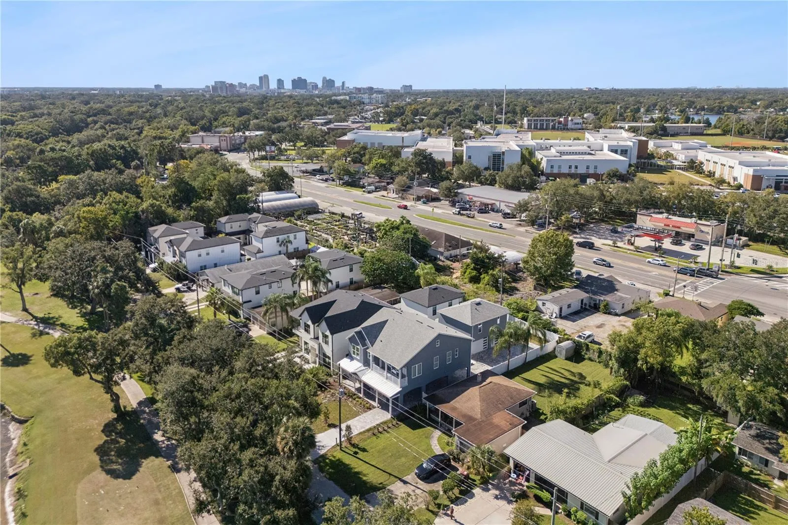 An aerial view shows the home and surrounding neighborhood of College Park with Orlando in the background.
