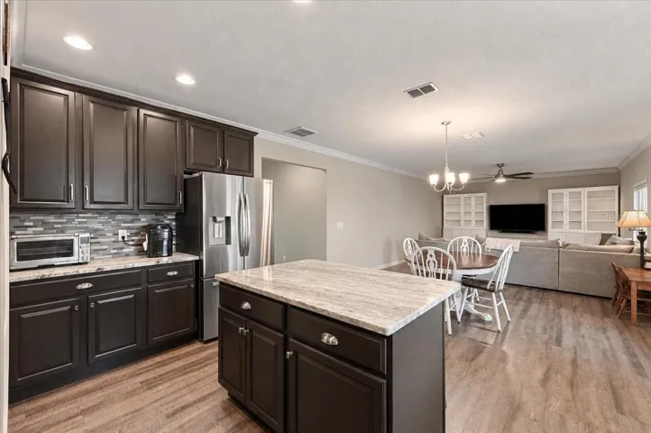 Overview of kitchen, nook and family room combo