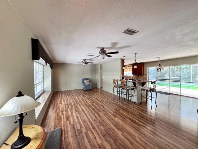 Living room open to kitchen/dining area