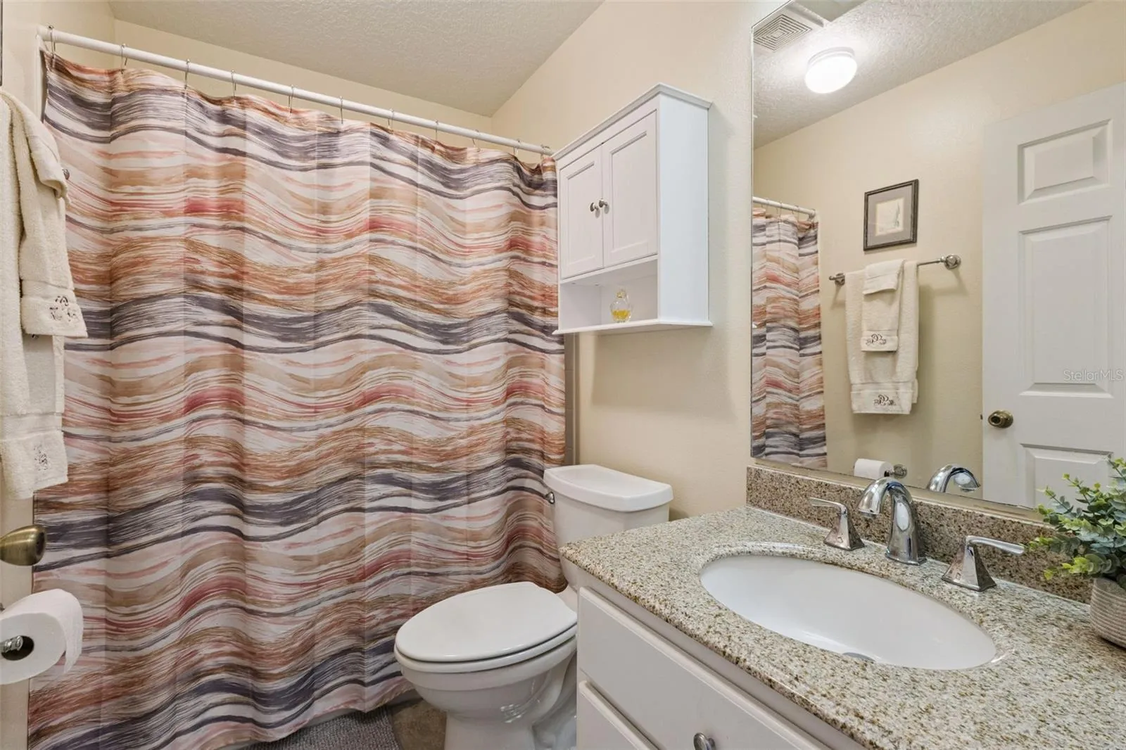 BATHROOM 2 has SOLID-SURFACE COUNTER, TUB/SHOWER COMBO and a WINDOW.