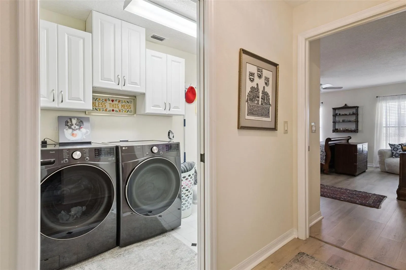 SPACIOUS LAUNDRY ROOM IS NEXT TO PRIMARY SUITE.  Washer &amp; Dryer do NOT convey.