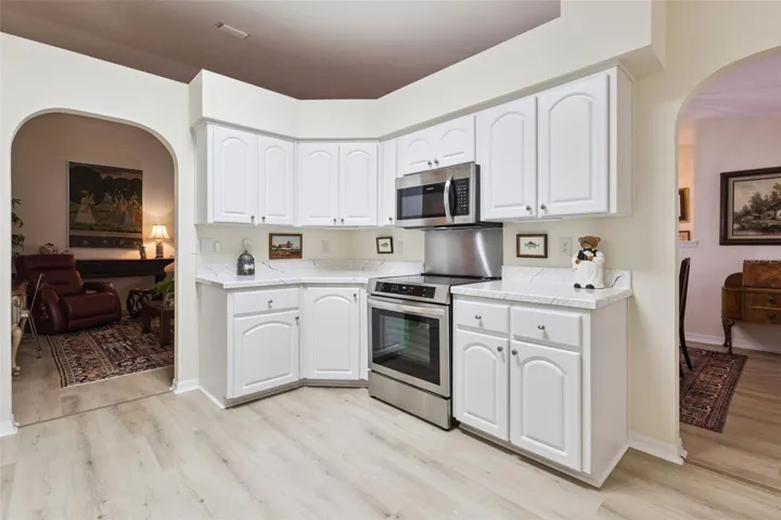 KITCHEN OPENS TO LIVING ROOM &amp; DINING AREA
