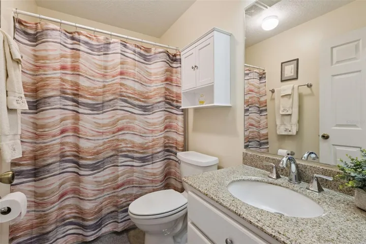 BATHROOM 2 has SOLID-SURFACE COUNTER, TUB/SHOWER COMBO and a WINDOW.