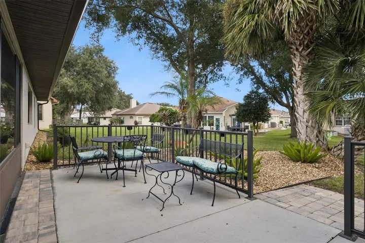 REAR PATIO leads to a BEAUTIFUL PARK-LIKE BACKYARD.