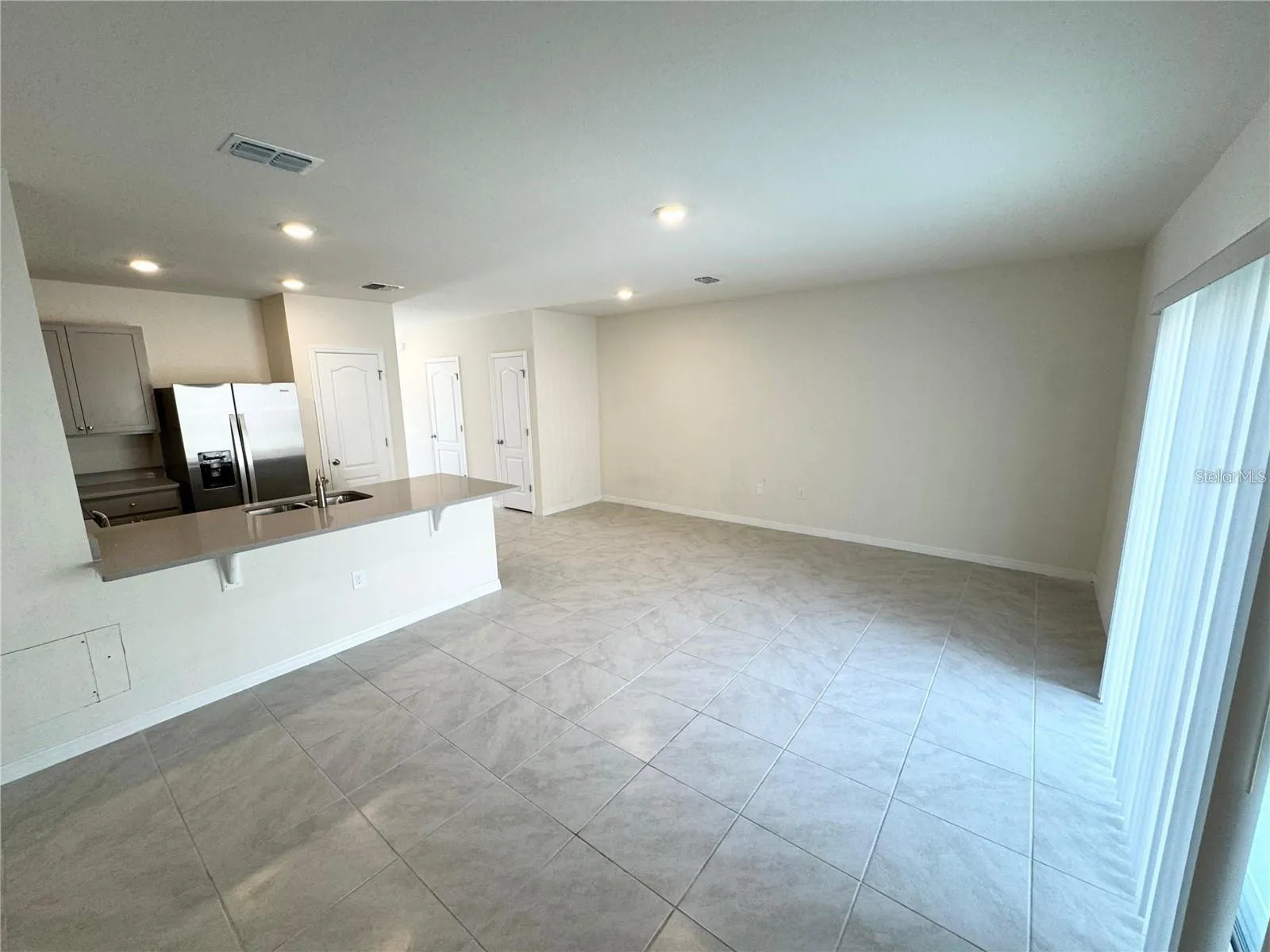 View from dining area, kitchen and living room area.