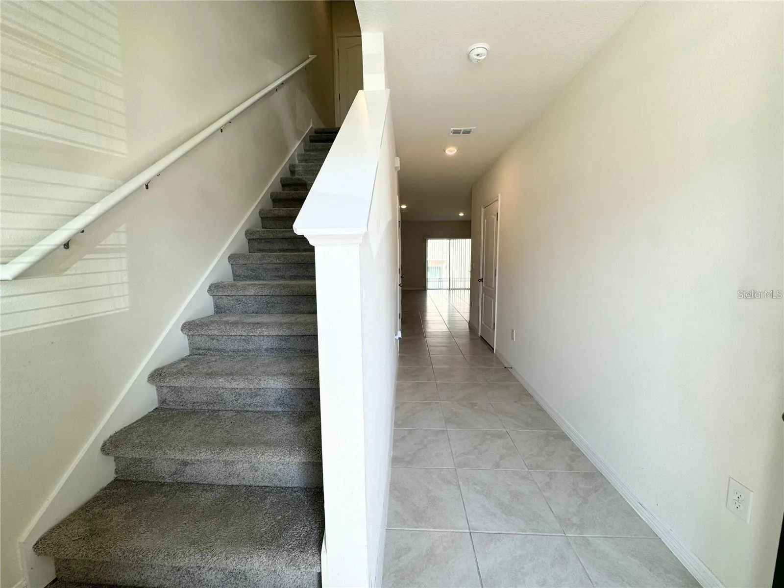 View toward second story, breezeway and closet.
