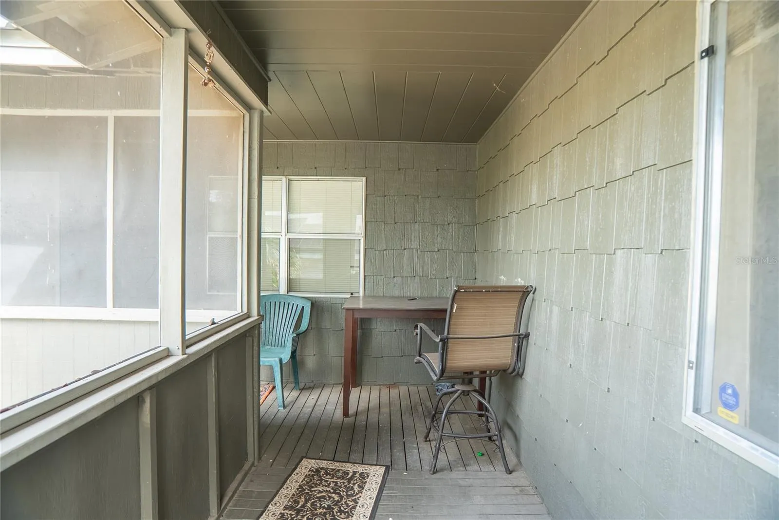 Wrap around front porch, screened in