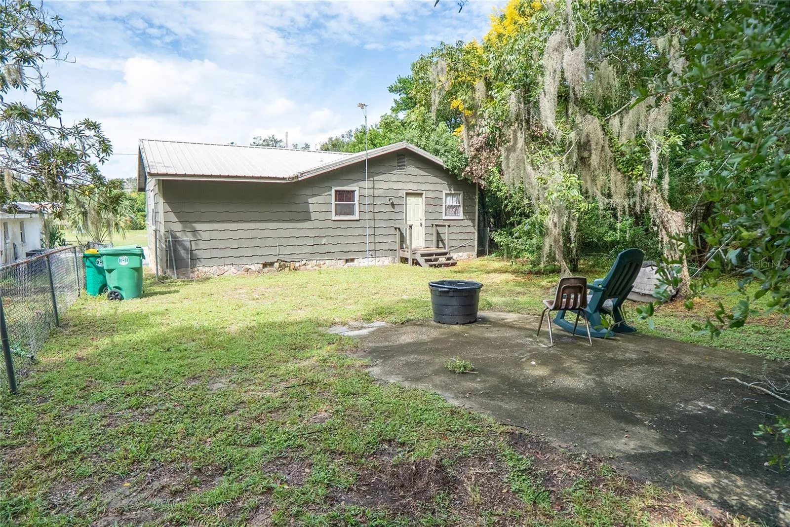 Rear entrance at 311 S Thompson Avenue, DeLand, FL 32720. Rear stairs need repair; do not use.