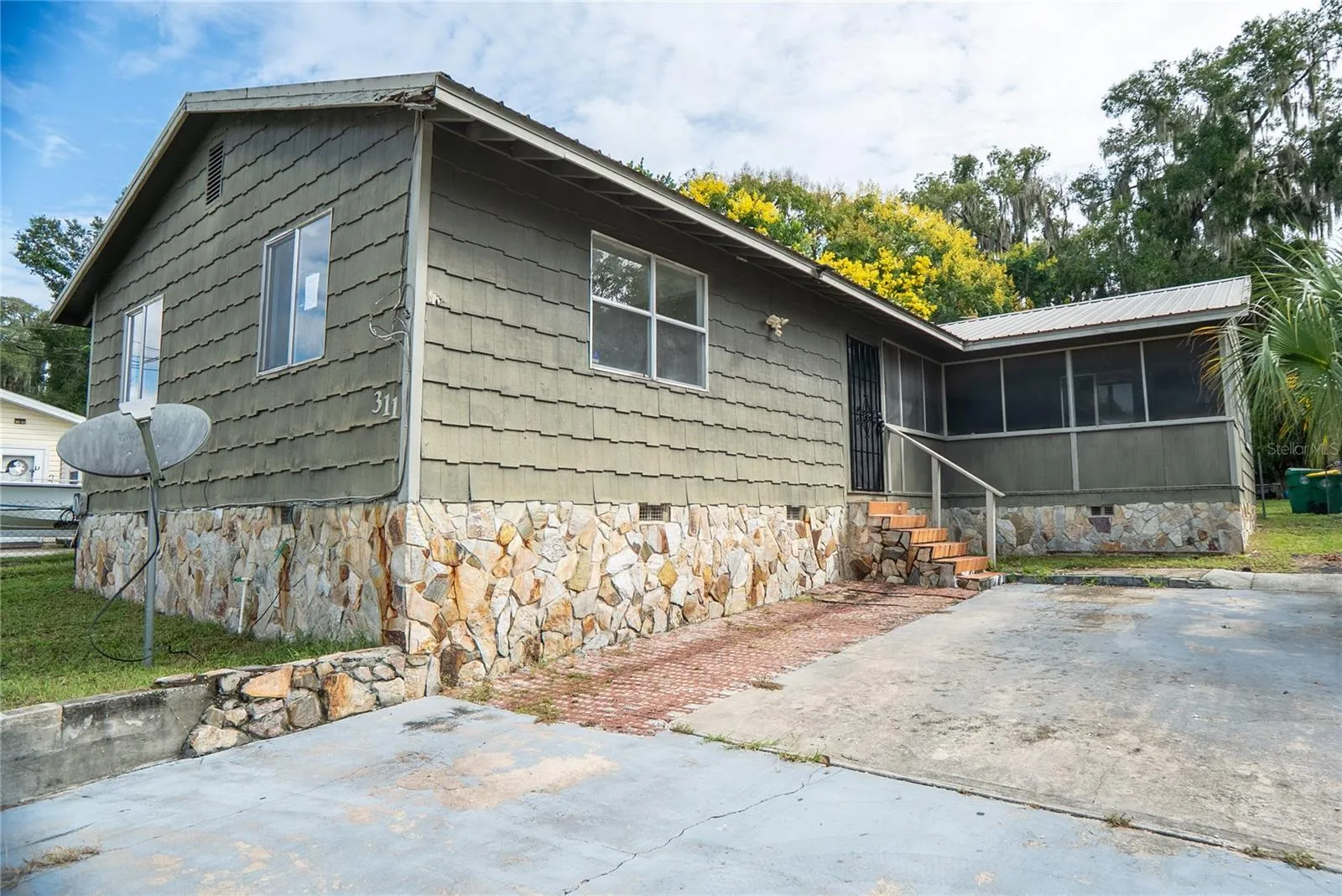 311 S Thompson Avenue, DeLand, FL 32720 — Three-bedroom, two-bathroom home offered at $150,000 in Volusia County. Short sale with renovation potential.