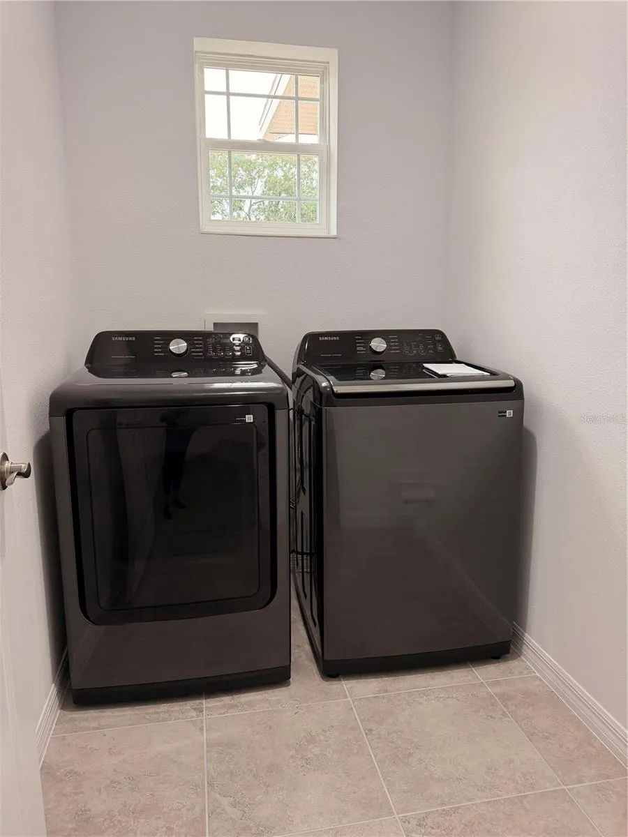 Laundry room with brand new Samsung washer/dryer