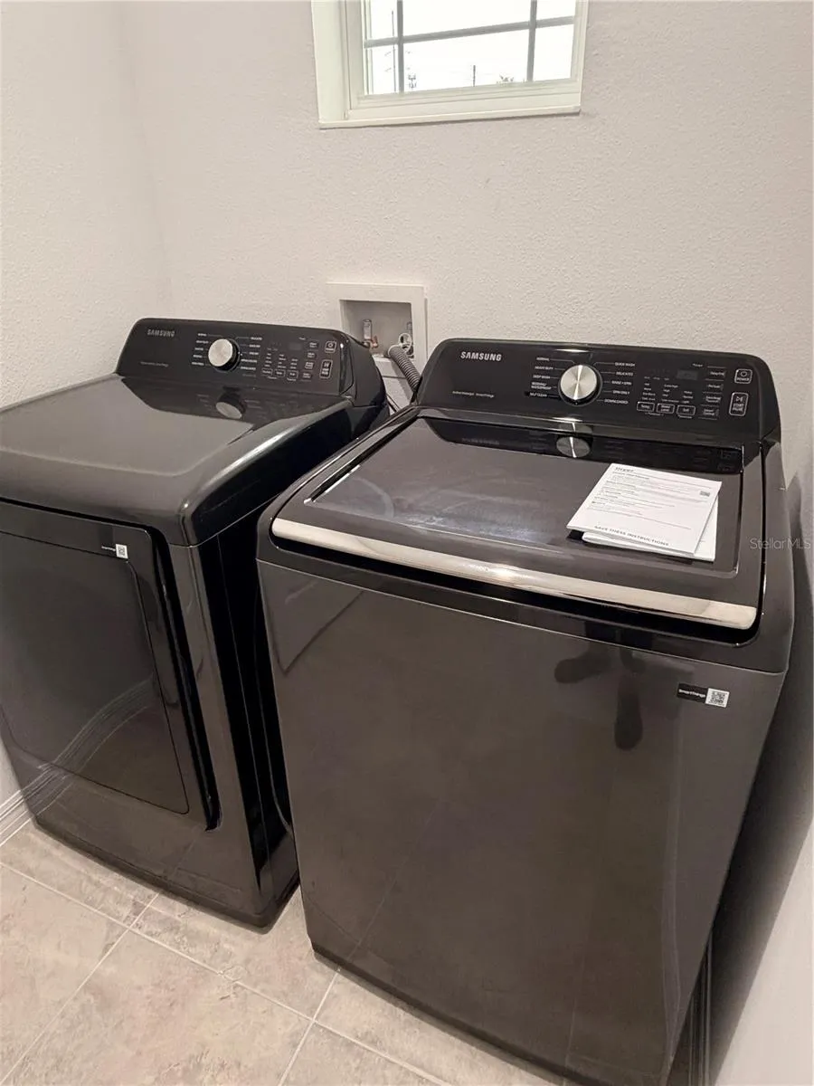 Laundry room with brand new Samsung washer/dryer