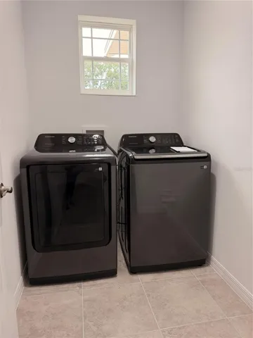 Laundry room with brand new Samsung washer/dryer