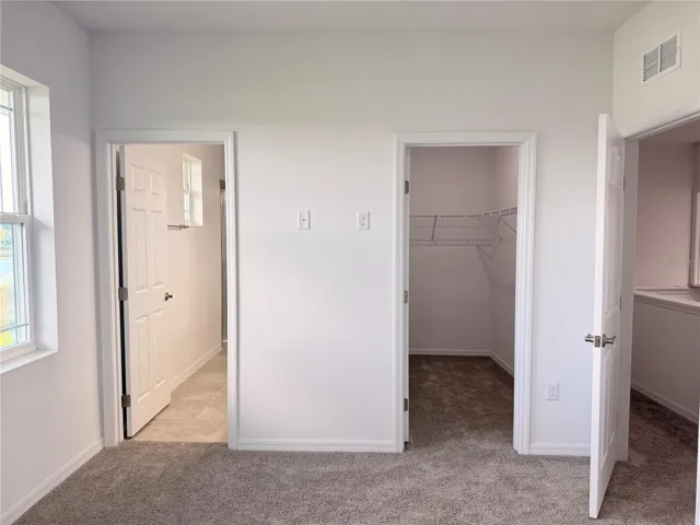 Master walk in closet and bathroom