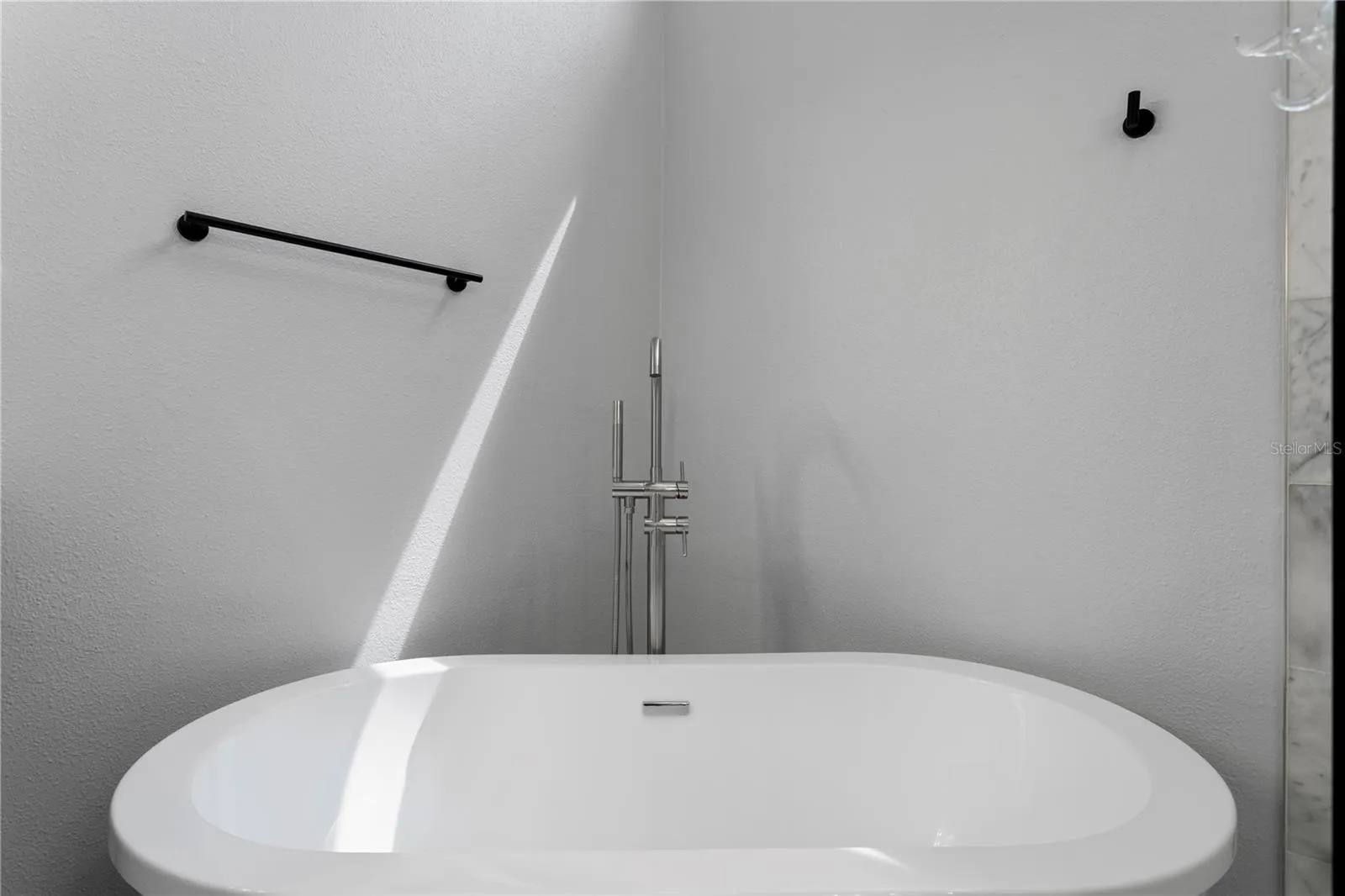 Unwind in the inviting freestanding soaking tub