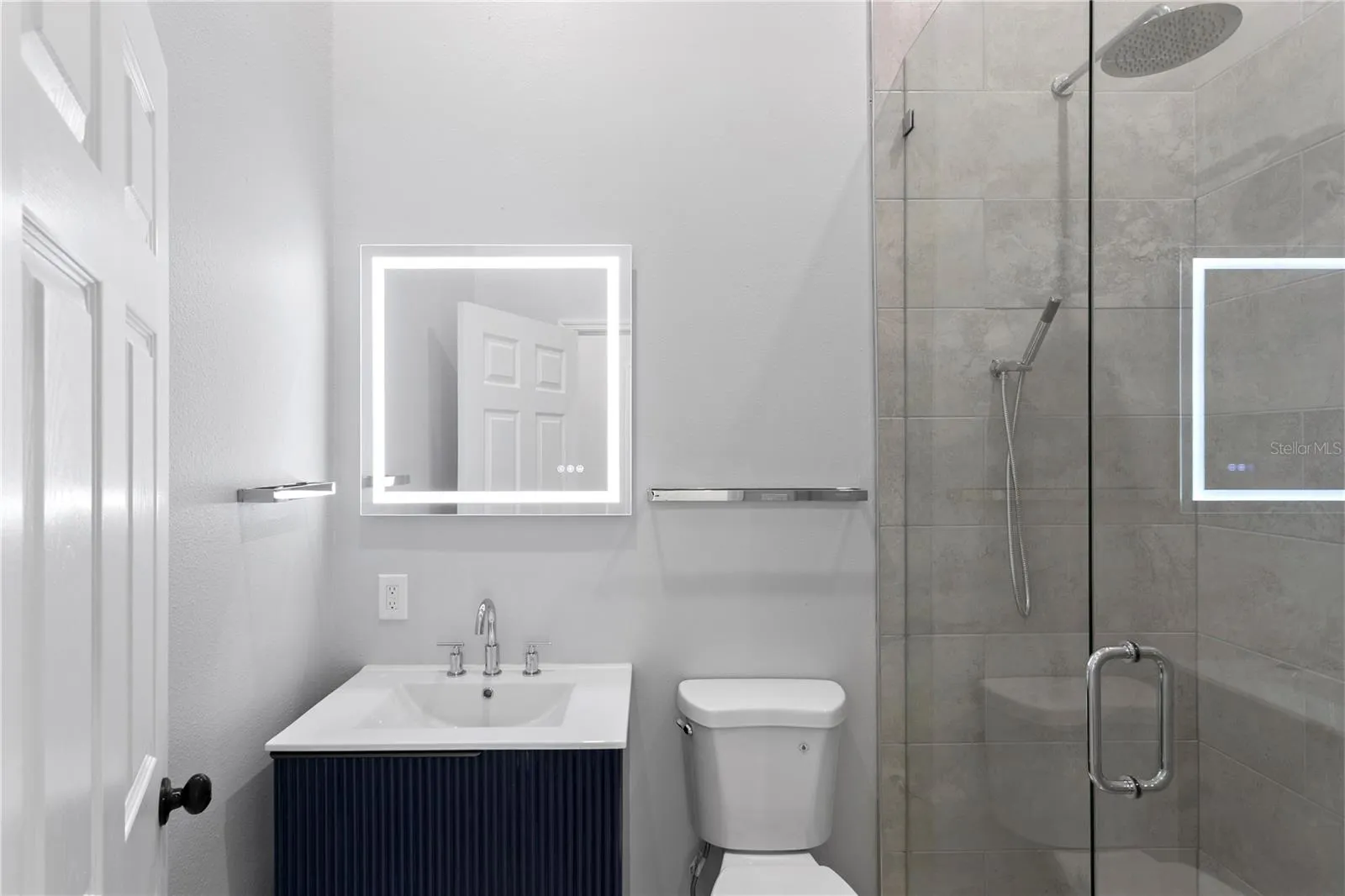 This elegantly appointed hall bath conveniently serves 2 of the bedrooms.