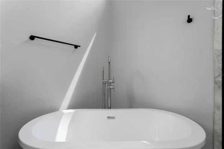 Unwind in the inviting freestanding soaking tub