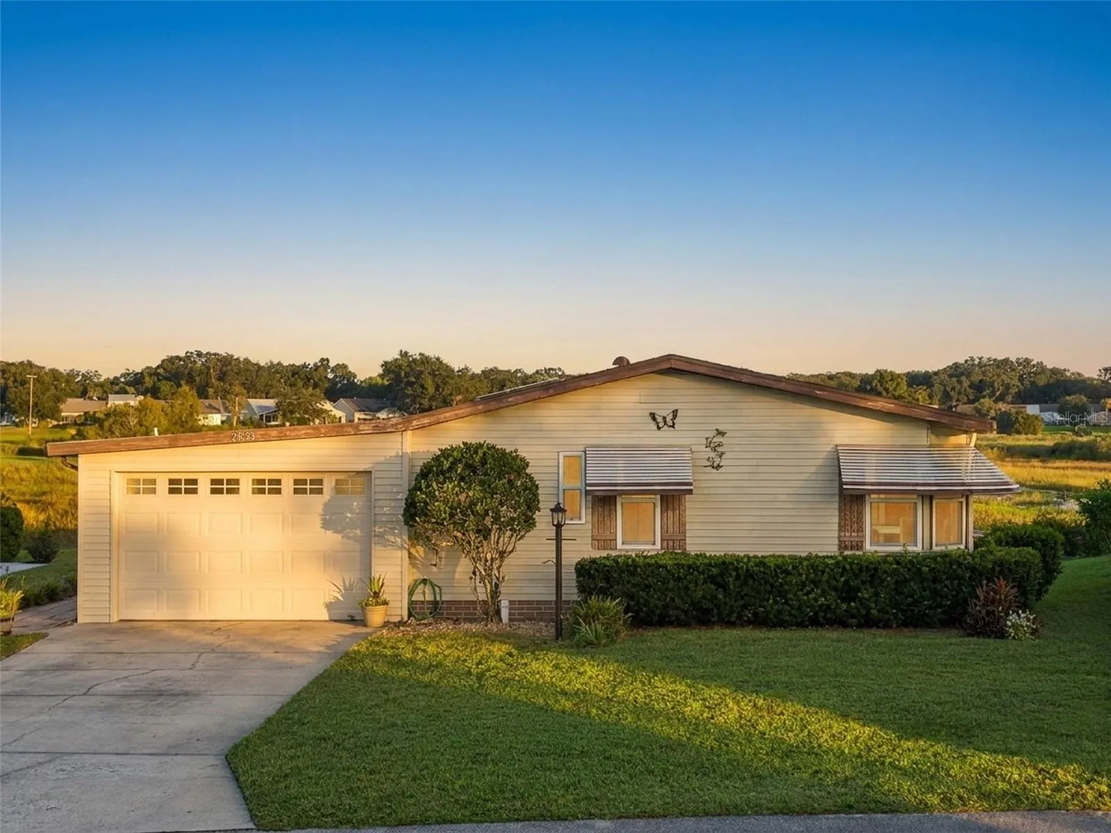Digitally enhanced golden-hour light: elevated front view with the open marsh behind