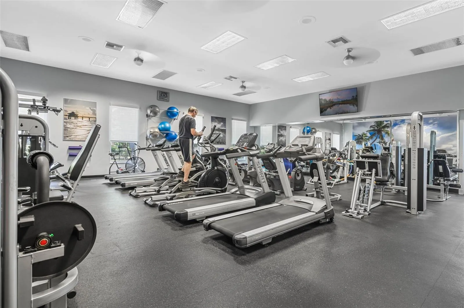 Community amenity: fitness center with treadmills and strength equipment