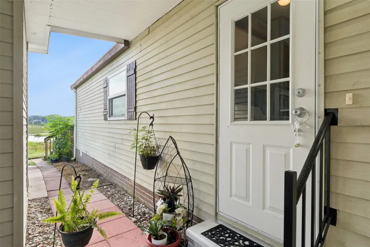 Side entry door and paver walkway leading to the backyard